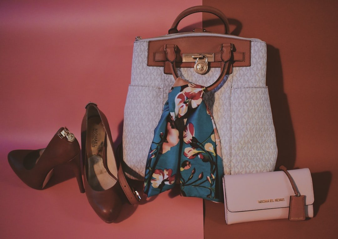Handbag, shoes, scarf, and wallet arranged as a coordinated outfit