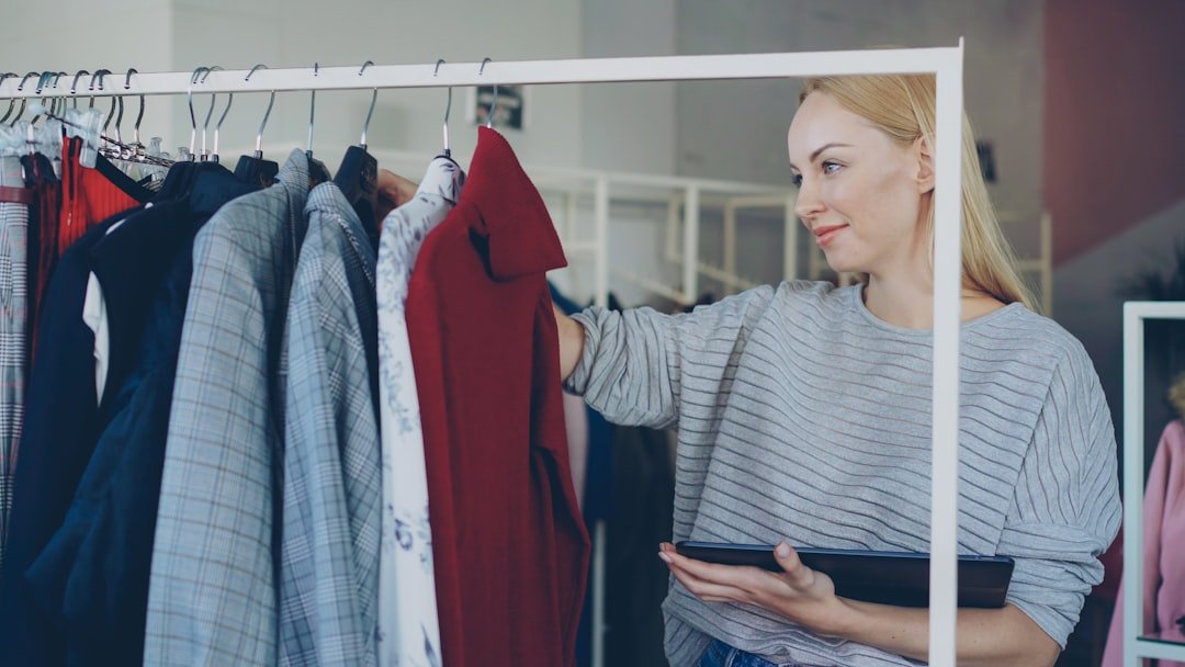 Woman looks at clothing on a rack